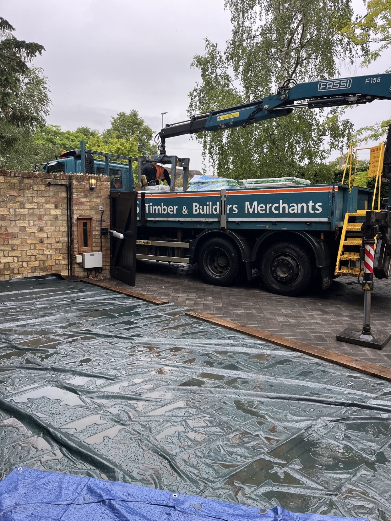 Finished porcelain patio surface during the final stage of the Godmanchester build, showing the completed slabs after installation