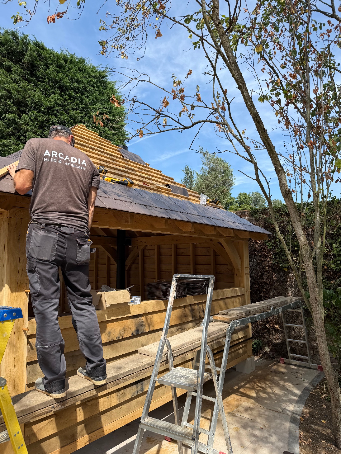 Arcadia Build and Landscape roofer slating the oak gazebo in Godmanchester, Cambridgeshire