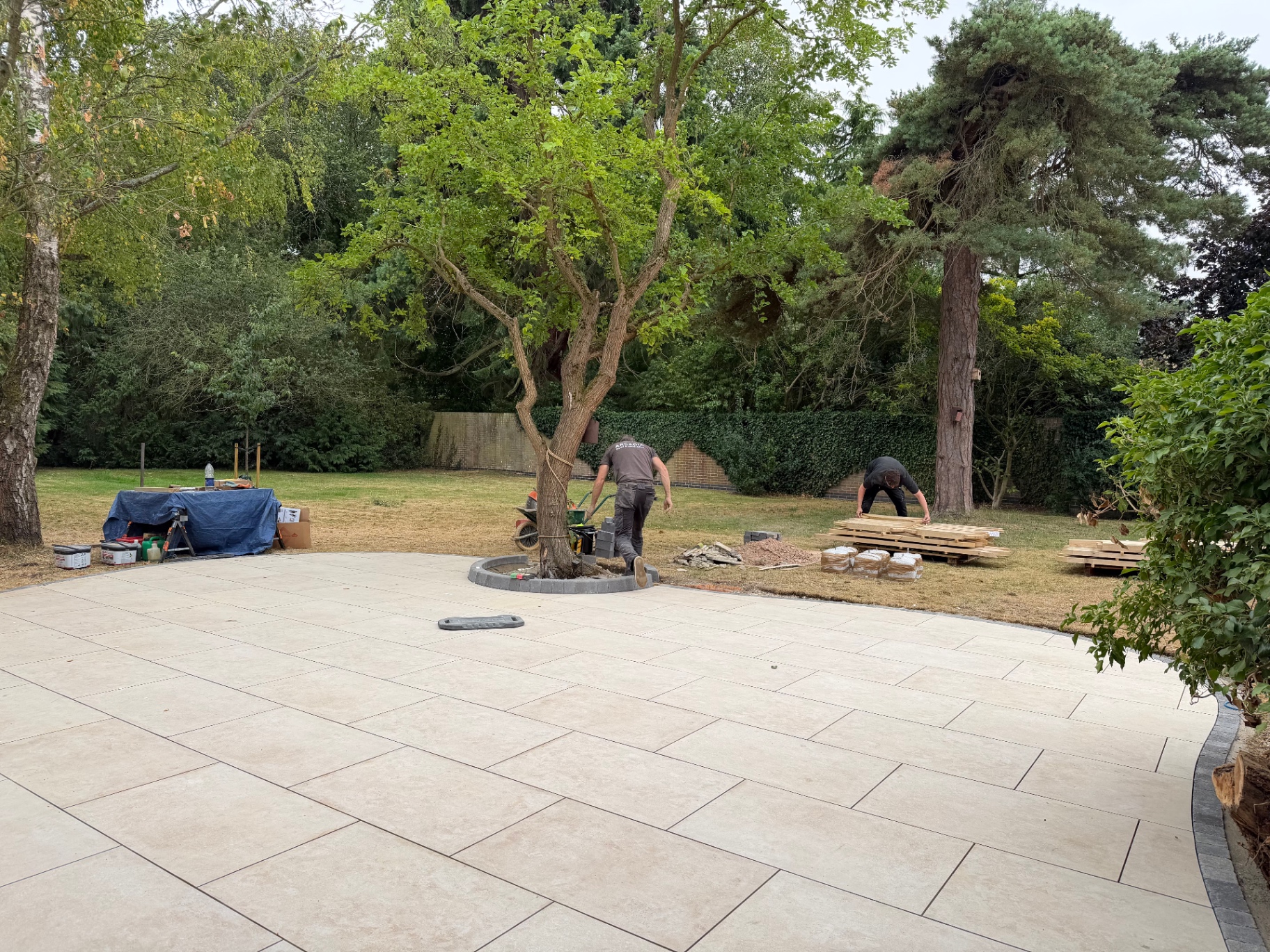 Arcadia Build and Landscape team unloading oak gazebo timbers beside the new patio in Godmanchester