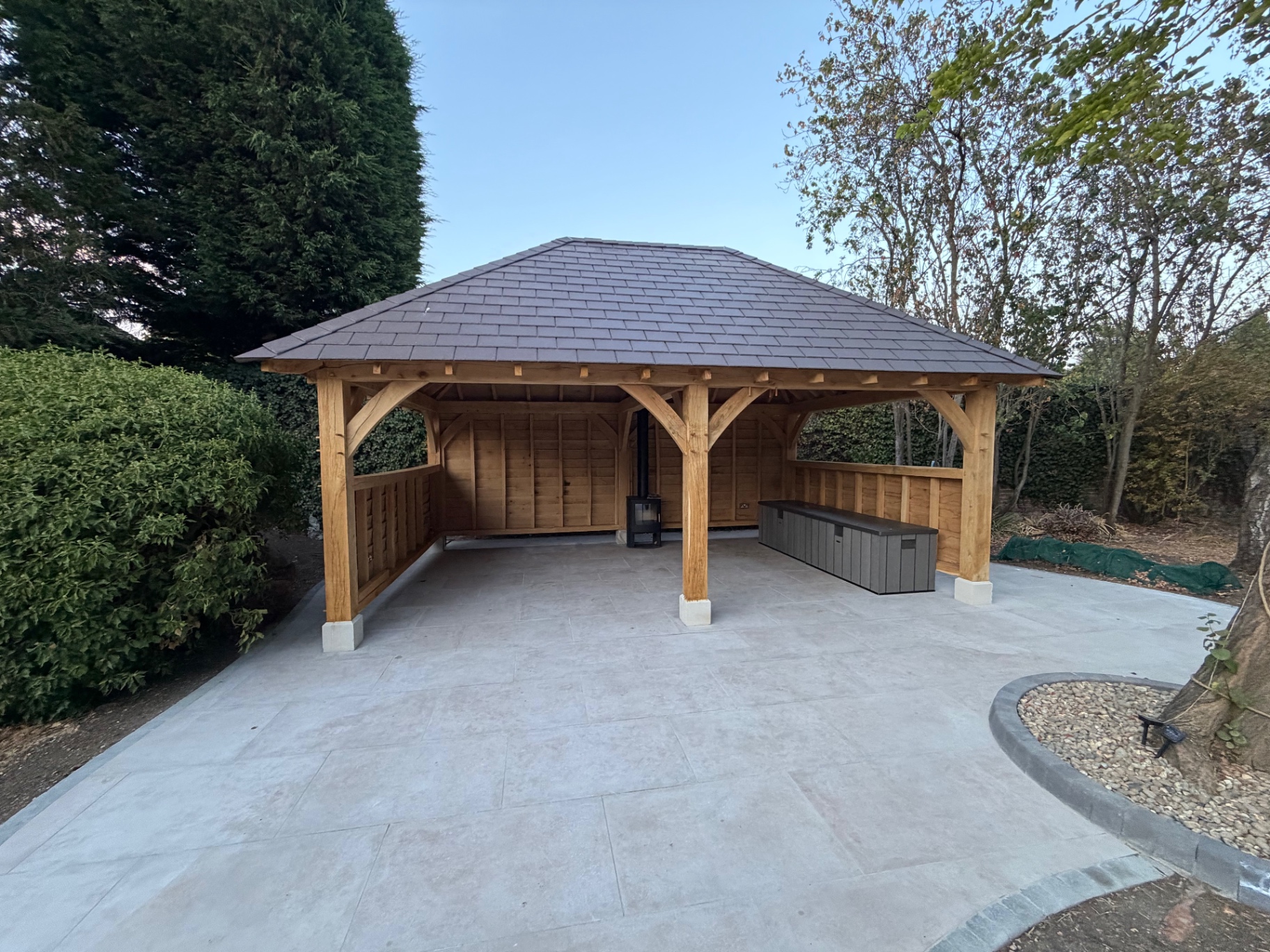 Porcelain patio and oak gazebo seating area in Godmanchester, Cambridgeshire