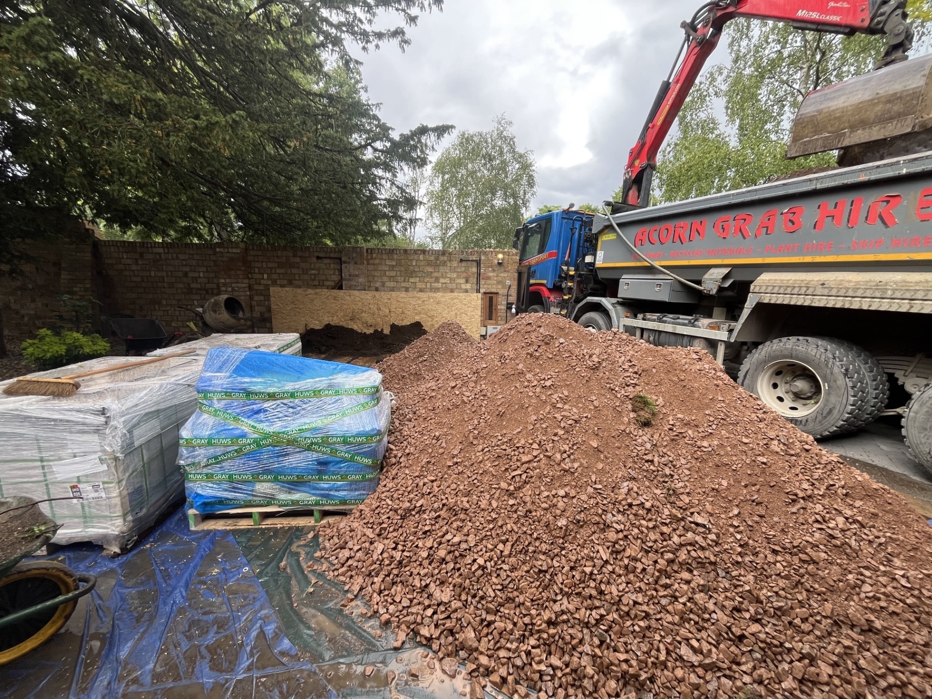 Godmanchester porcelain patio project - aggregate delivery and groundwork stage by Arcadia Build & Landscape