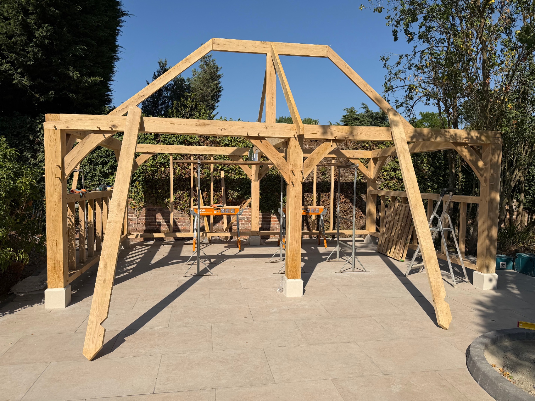 Oak gazebo gable truss raised above the frame in Godmanchester, Cambridgeshire