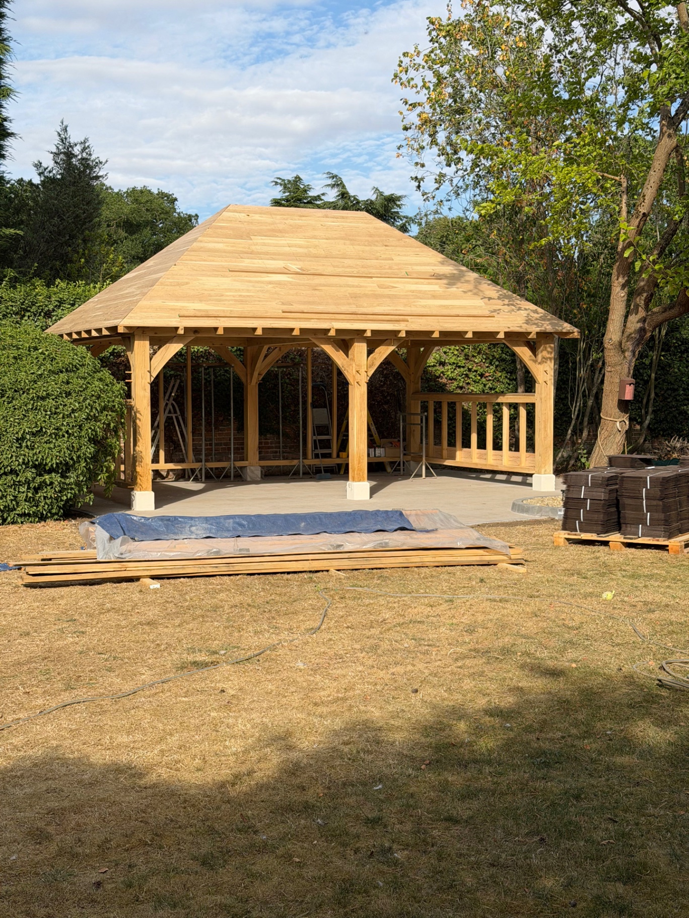 Oak gazebo with fully boarded roof and slate pallets ready in Godmanchester, Cambridgeshire