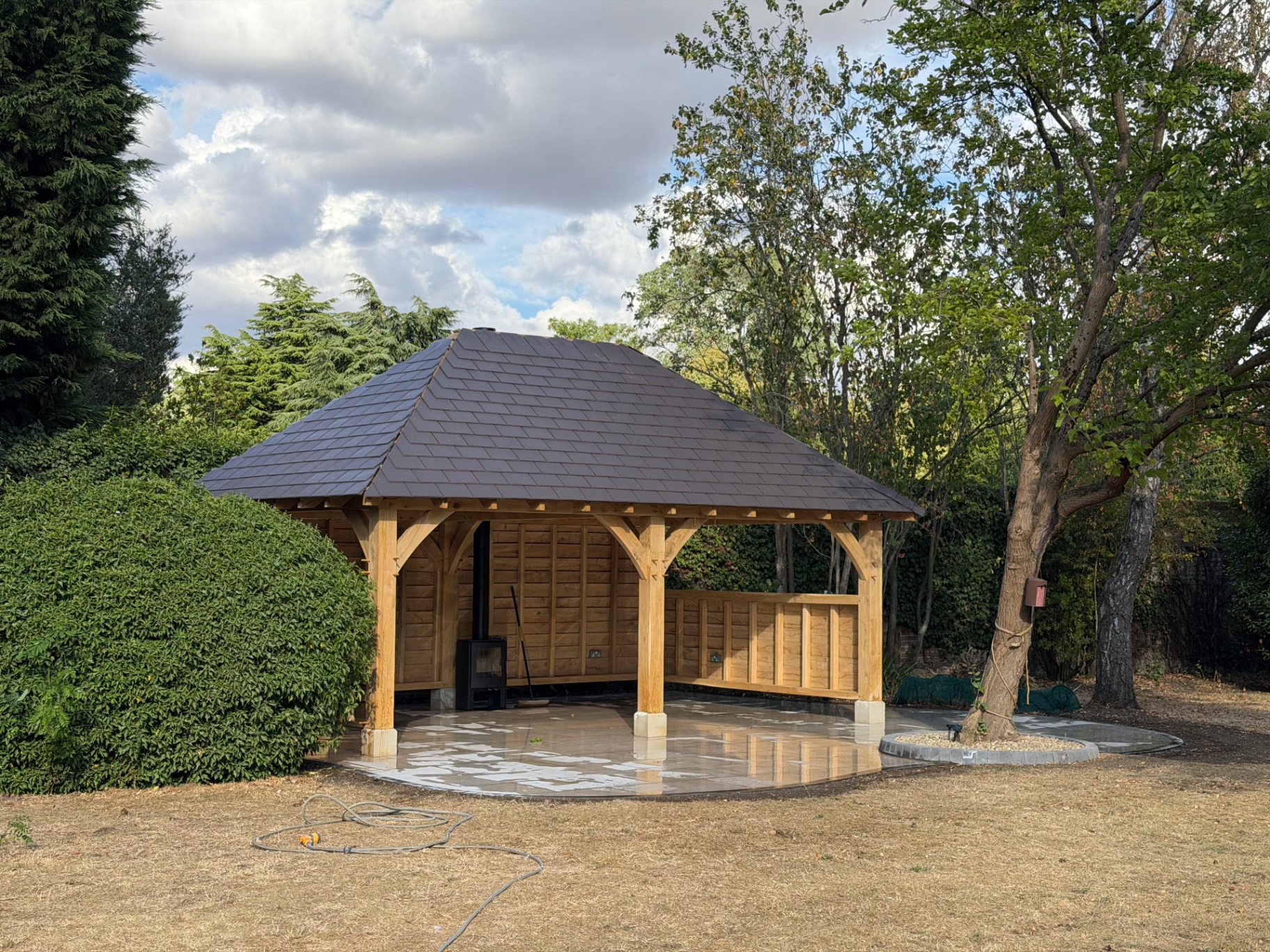 Slated oak gazebo over the finished porcelain patio in Godmanchester, Cambridgeshire