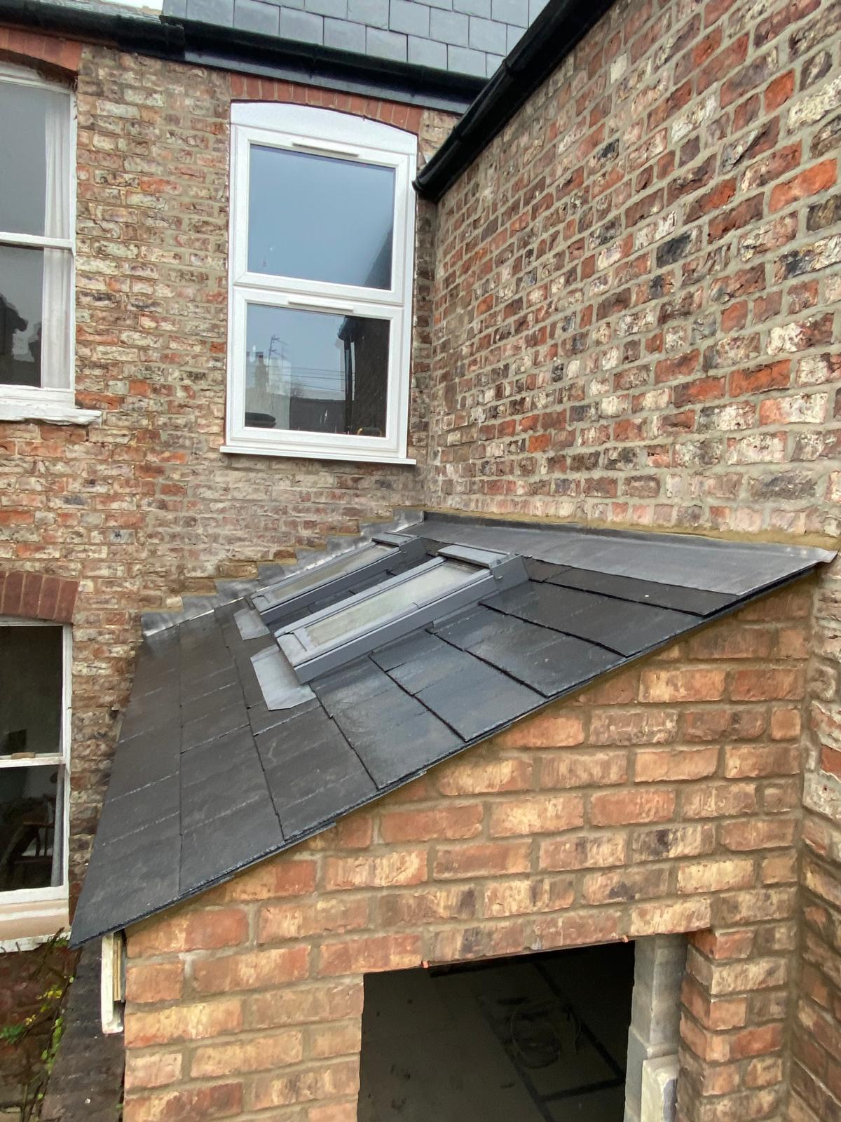 Close-up of finished slate roof and Velux windows on Cambridgeshire side extension