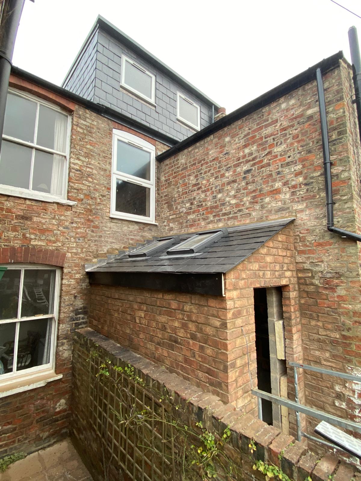 Rear elevation showing completed slate roof on new side extension in Cambridgeshire