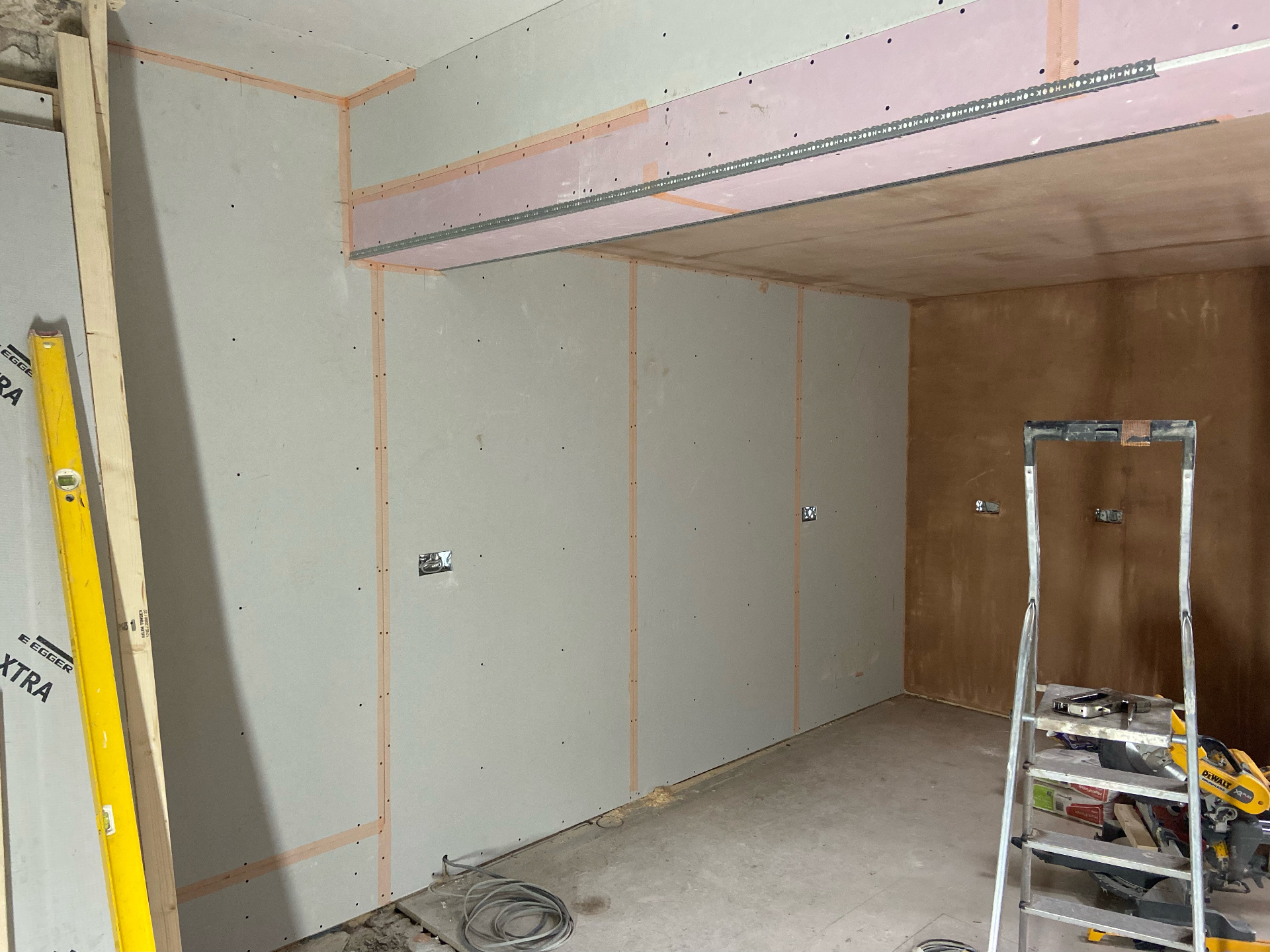 Fire-rated plasterboard boxing around new steel beam in Cambridgeshire extension