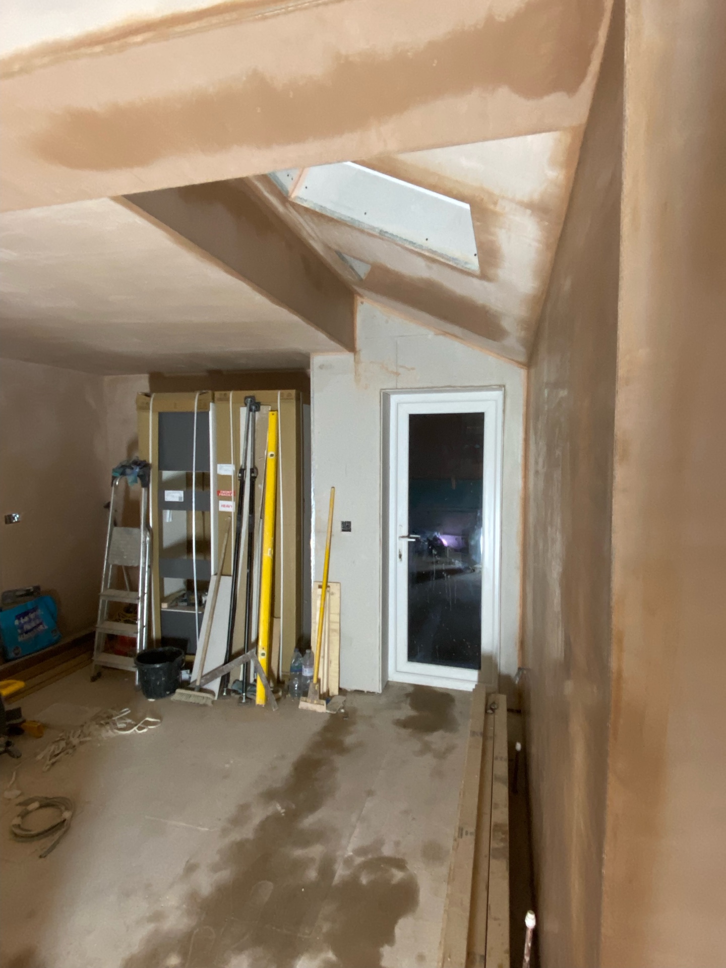 Fresh plaster finish to vaulted ceiling and Velux skylight in Cambridgeshire extension