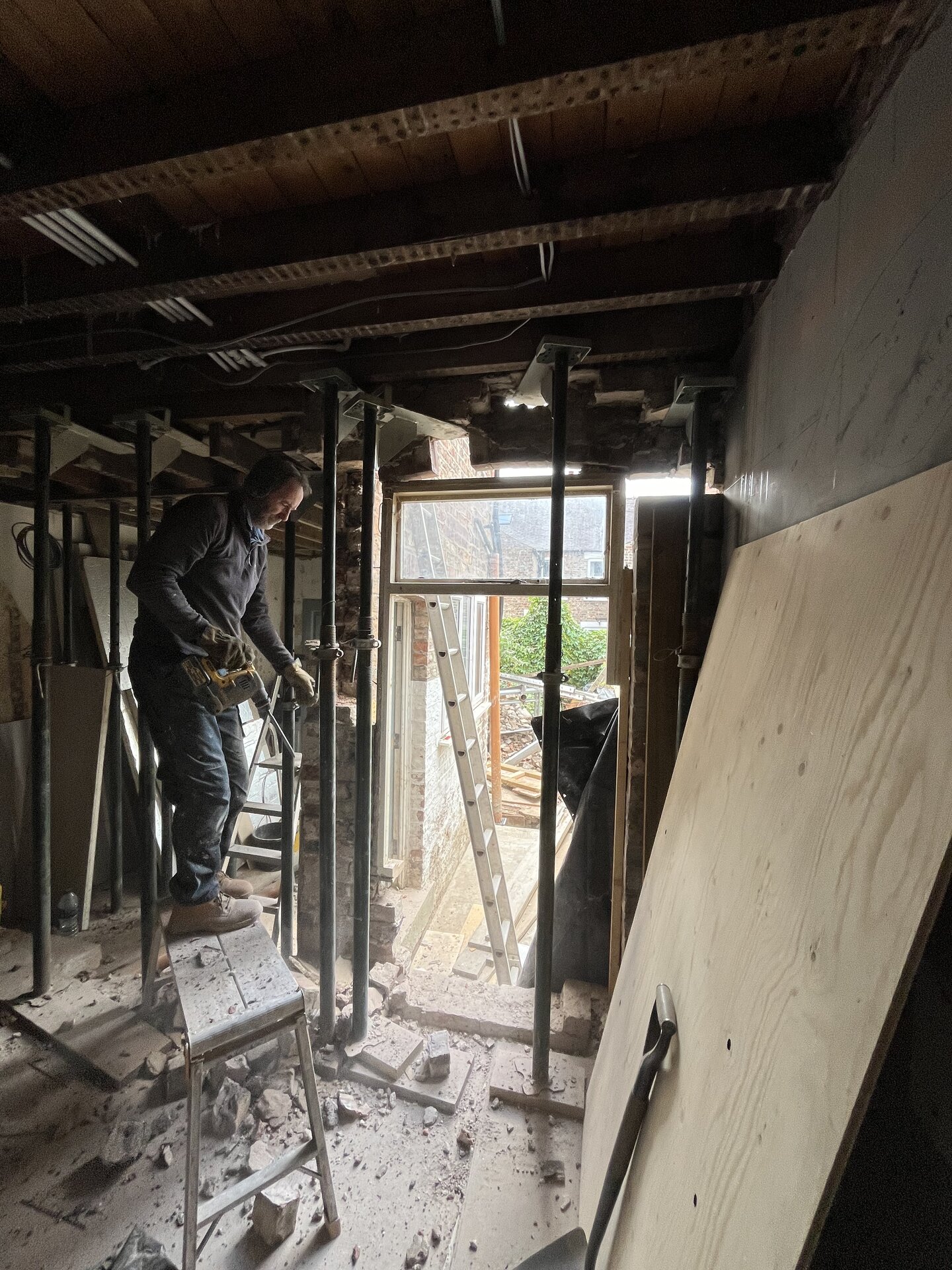 Acrow props supporting structure during installation of structural steel beams in Cambridgeshire extension