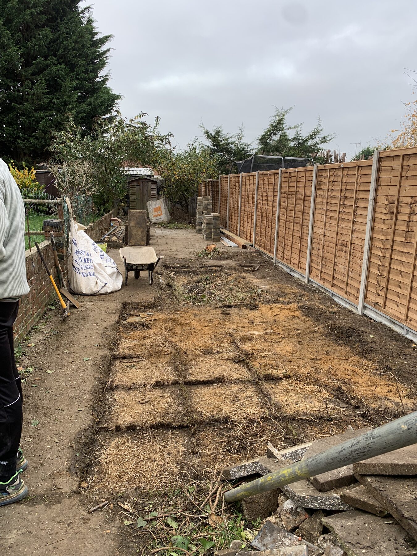 Old paving being lifted and ground prepared for new block paving in Fletton