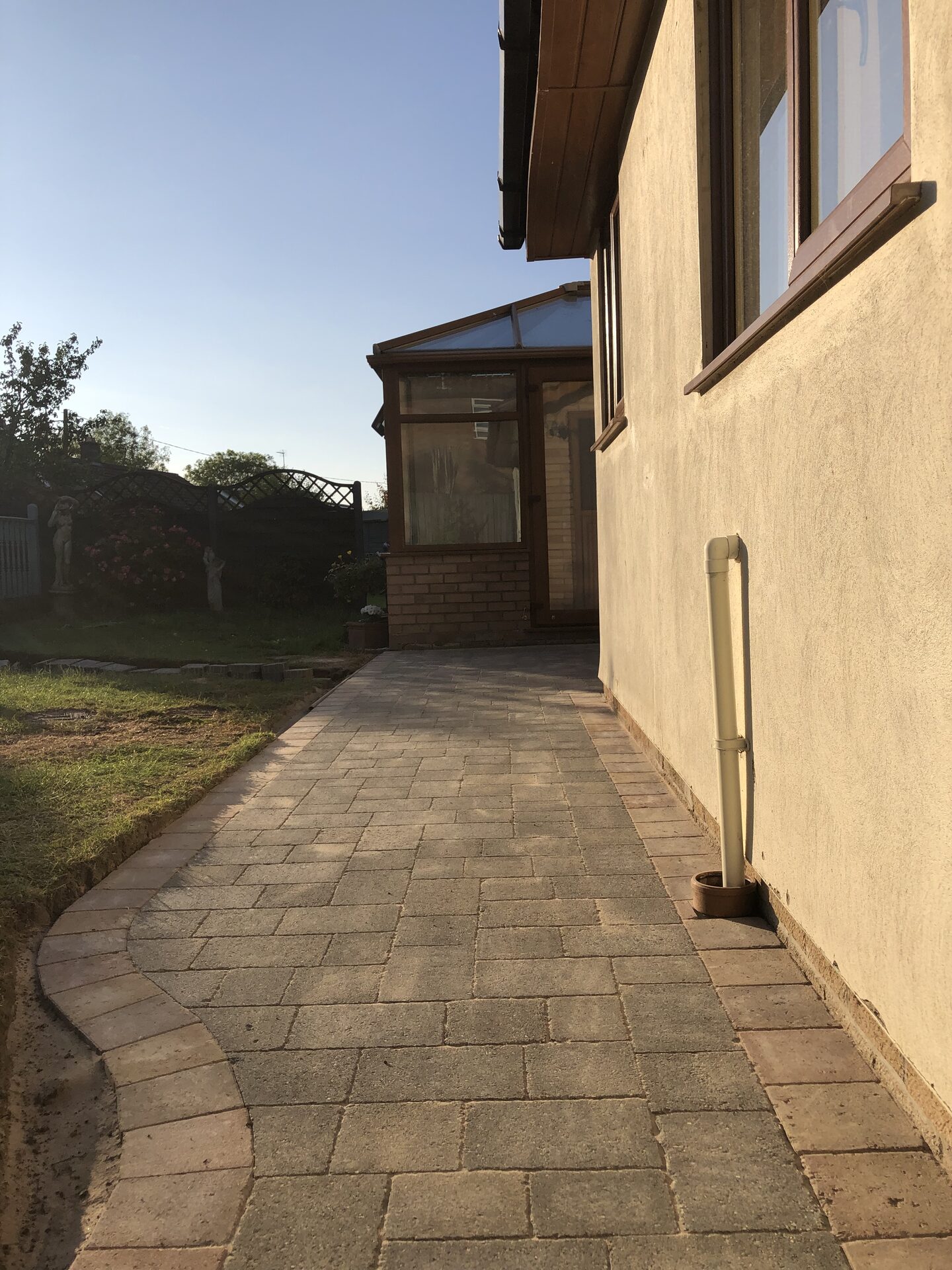 New curved block-paved pathway running alongside the property in Folksworth, Cambridgeshire