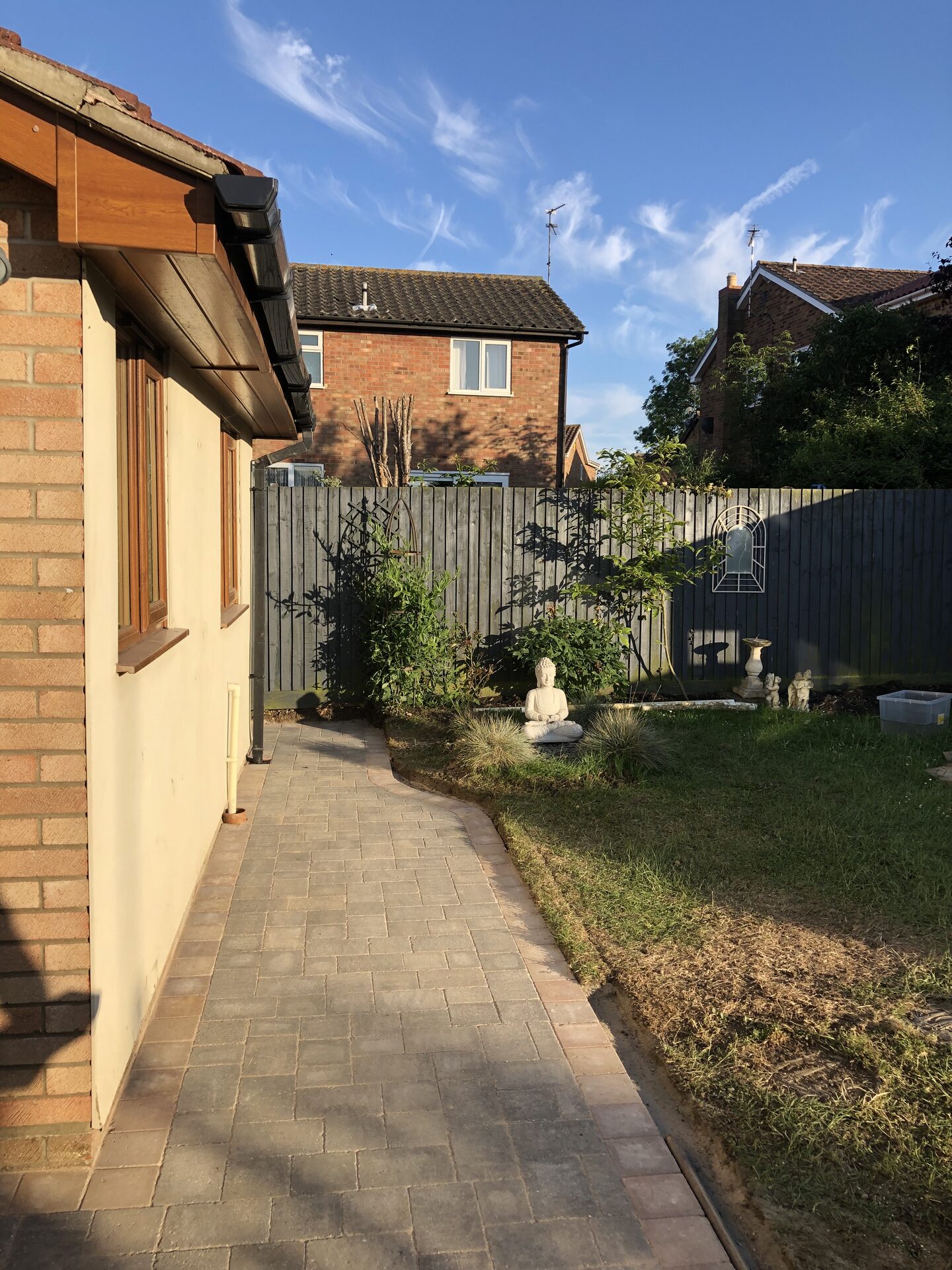 Block-paved side return pathway and tidy garden in Folksworth, Cambridgeshire