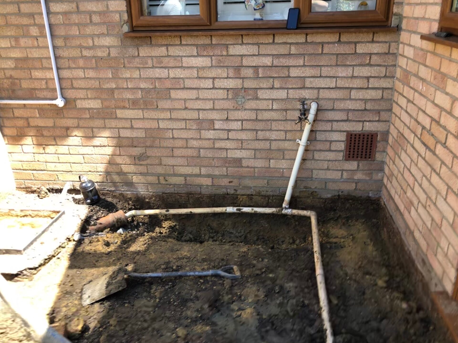 Incorrect drainage uncovered during patio excavation in Folksworth, Cambridgeshire