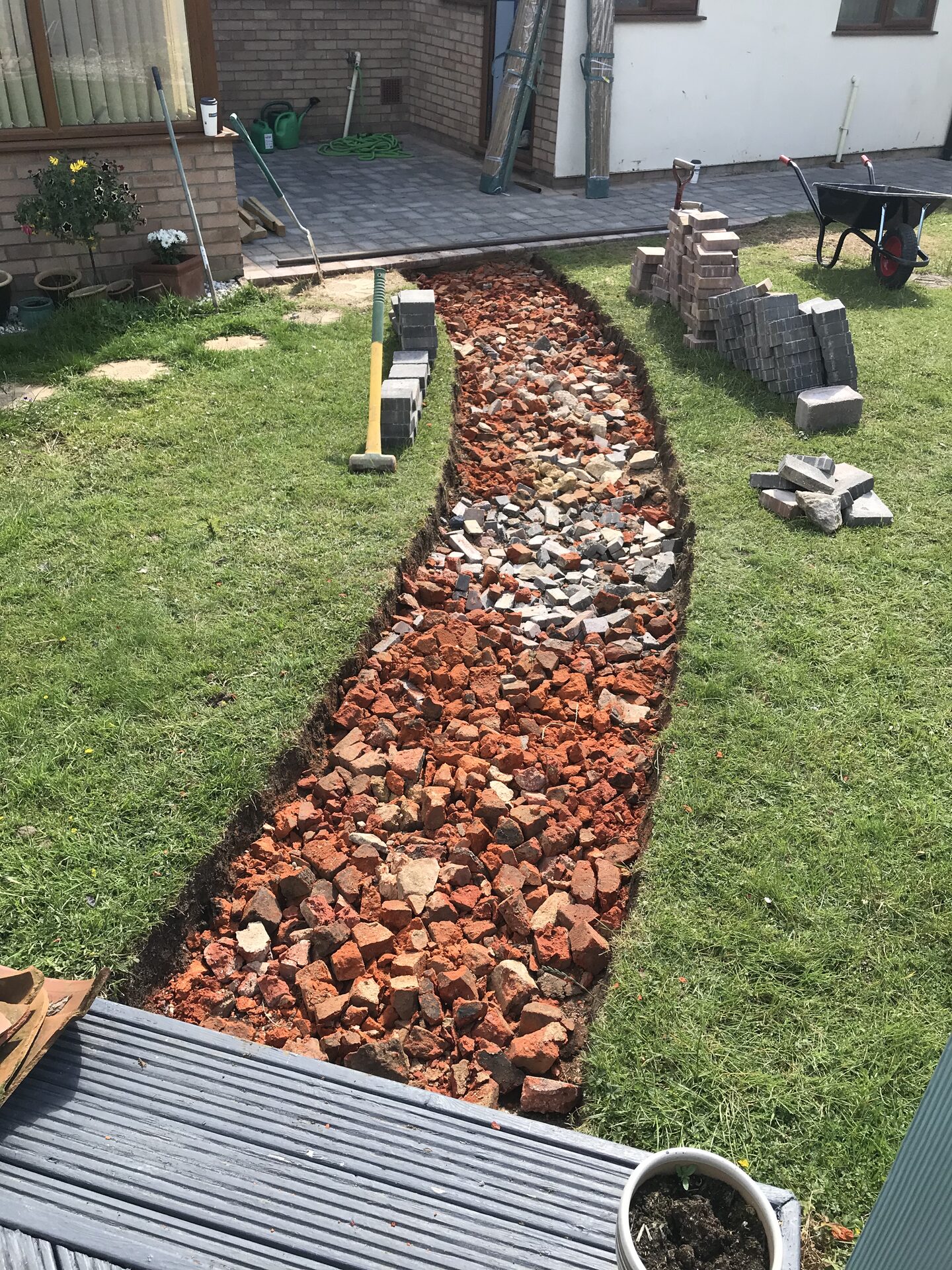 Compacted MOT type 1 sub-base for block paving patio in Folksworth, Cambridgeshire
