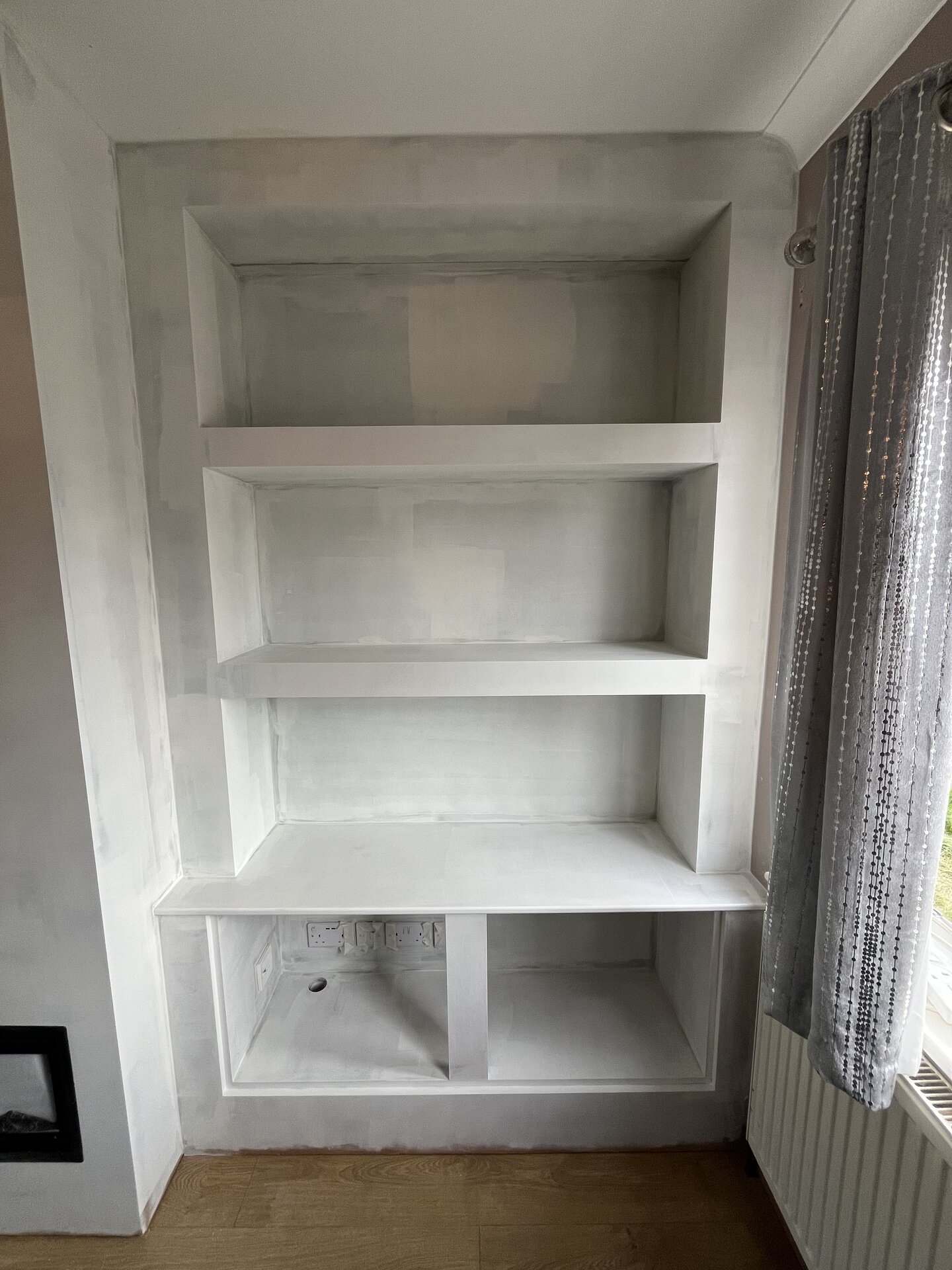 Side alcove painted in soft white ready for top coat in Sawtry living room