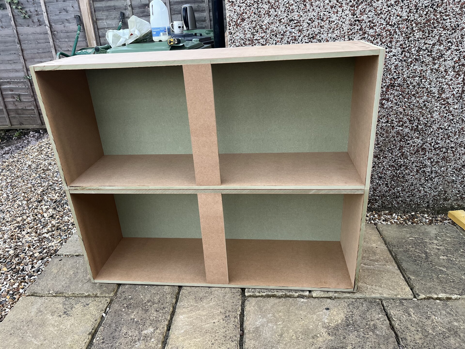 Assembled MDF base cabinet ready to be installed into the media wall in Sawtry