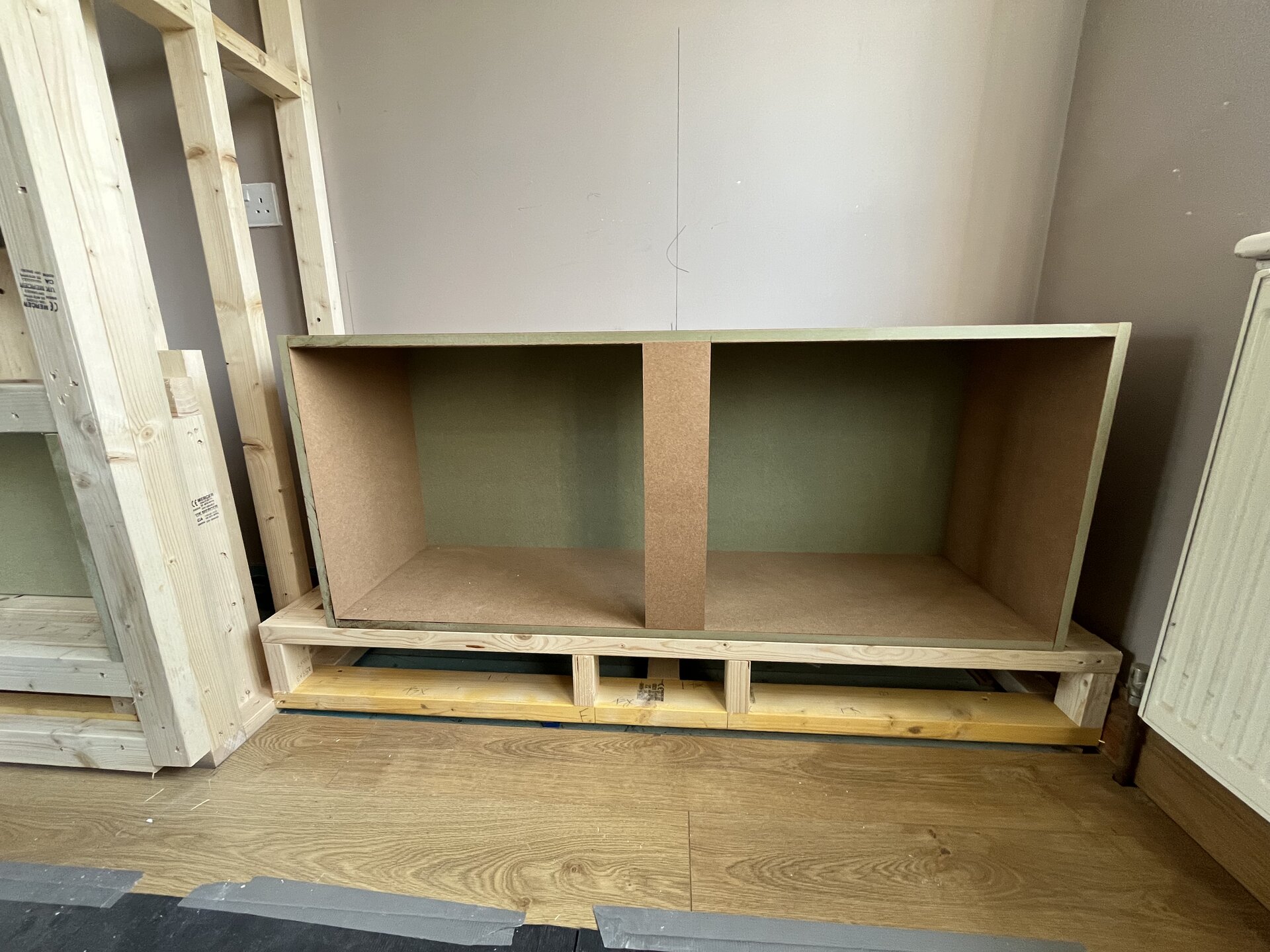 Cutting MDF panels on a workbench outside the property in Sawtry