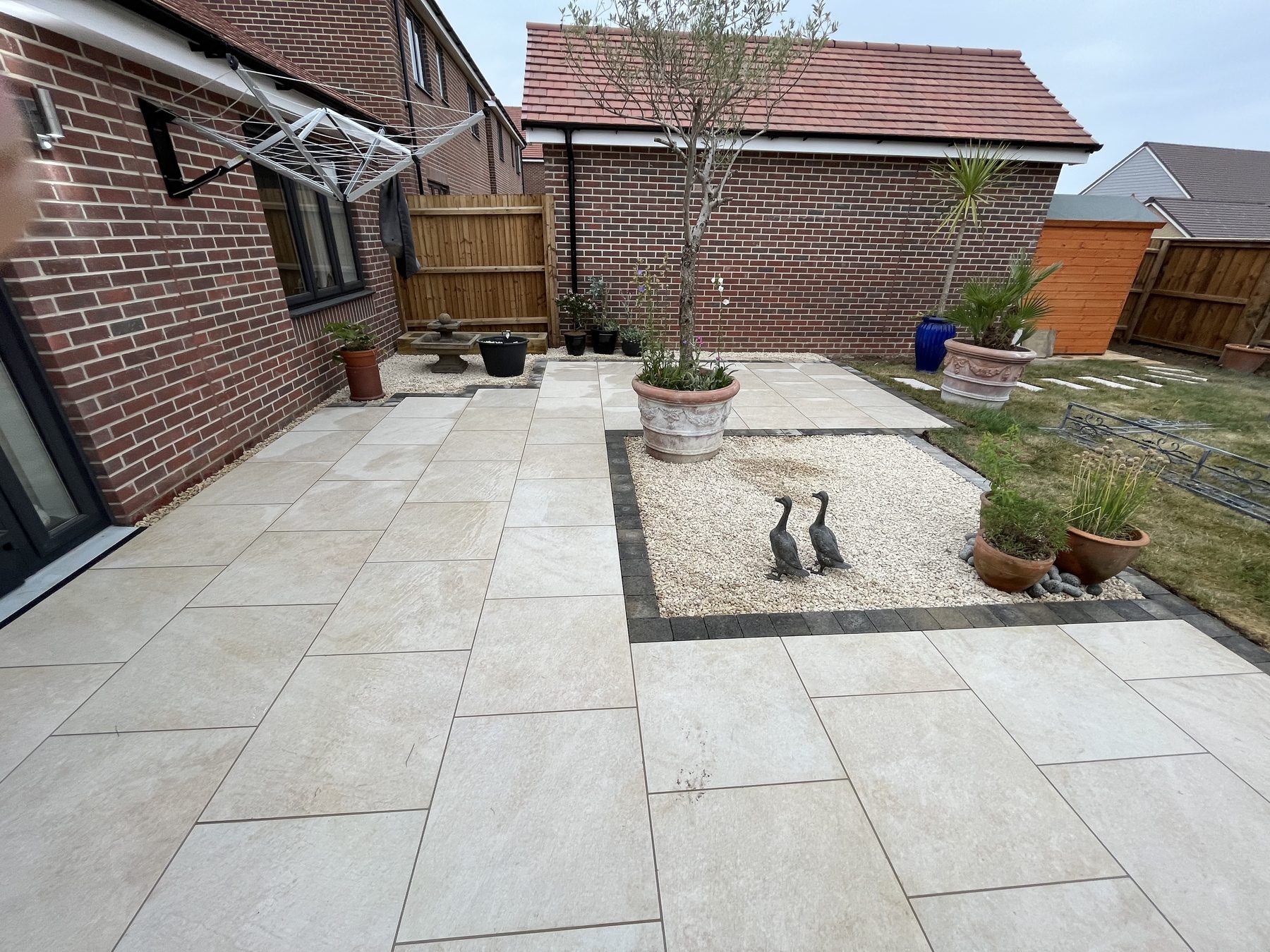 Completed porcelain patio with sett border in Stilton, Cambridgeshire