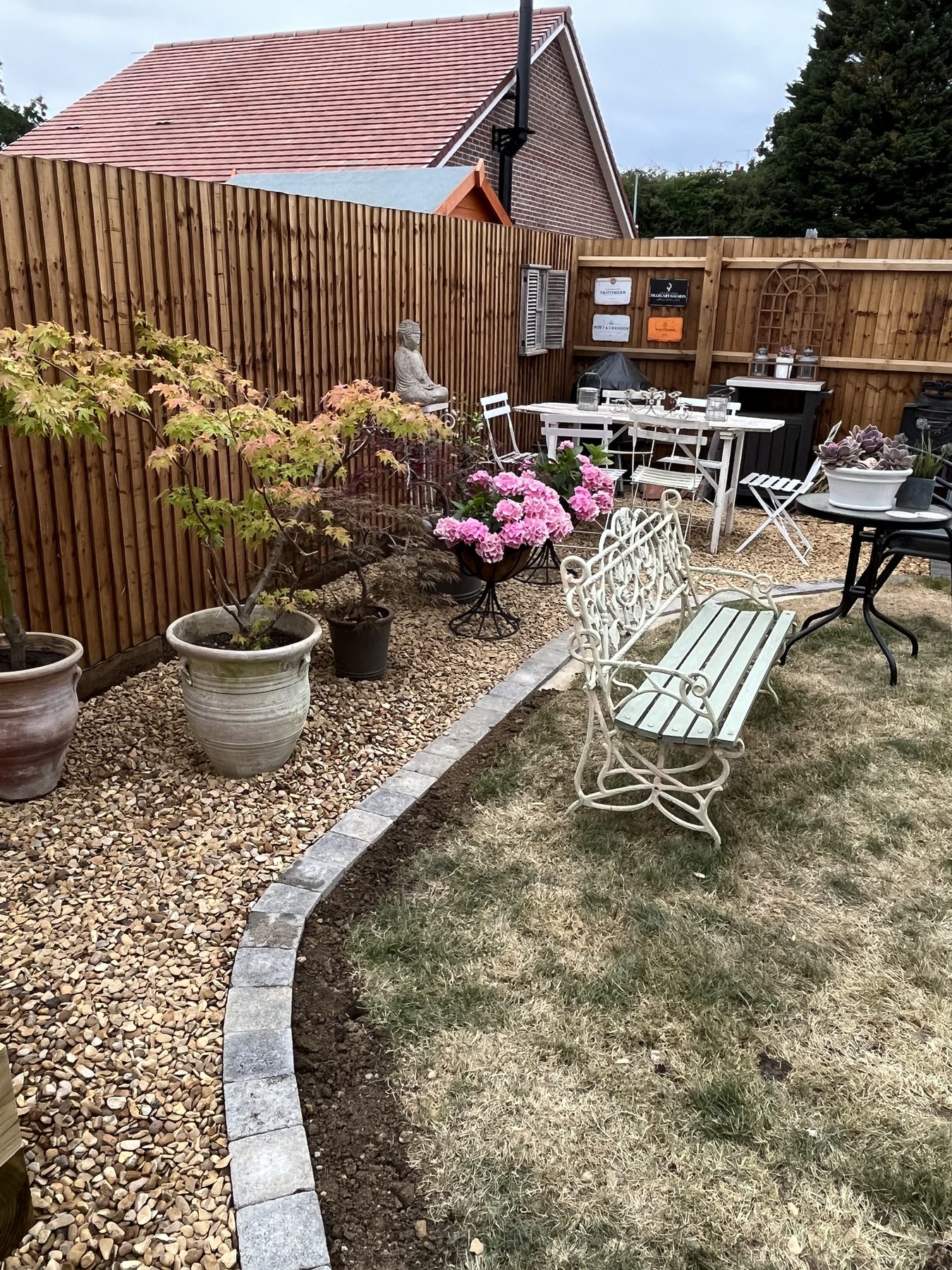 Completed porcelain patio with planting in Stilton