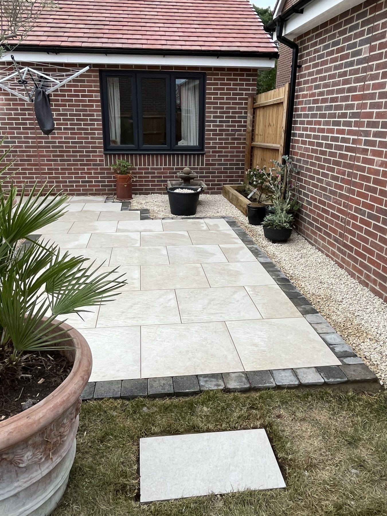 Porcelain patio with feature planting in Stilton, Cambridgeshire