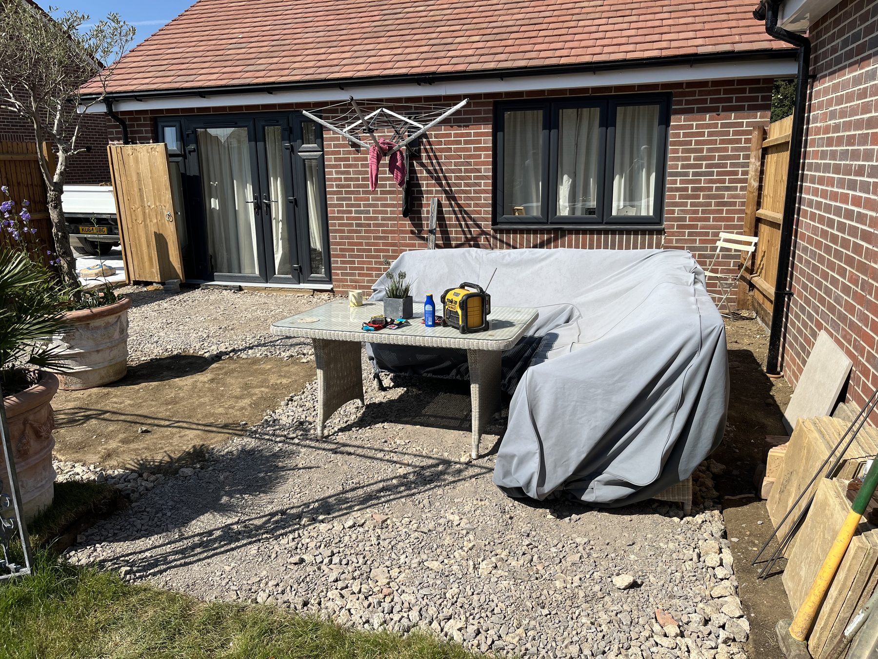 Compacted MOT type 1 sub base for porcelain paving in Stilton