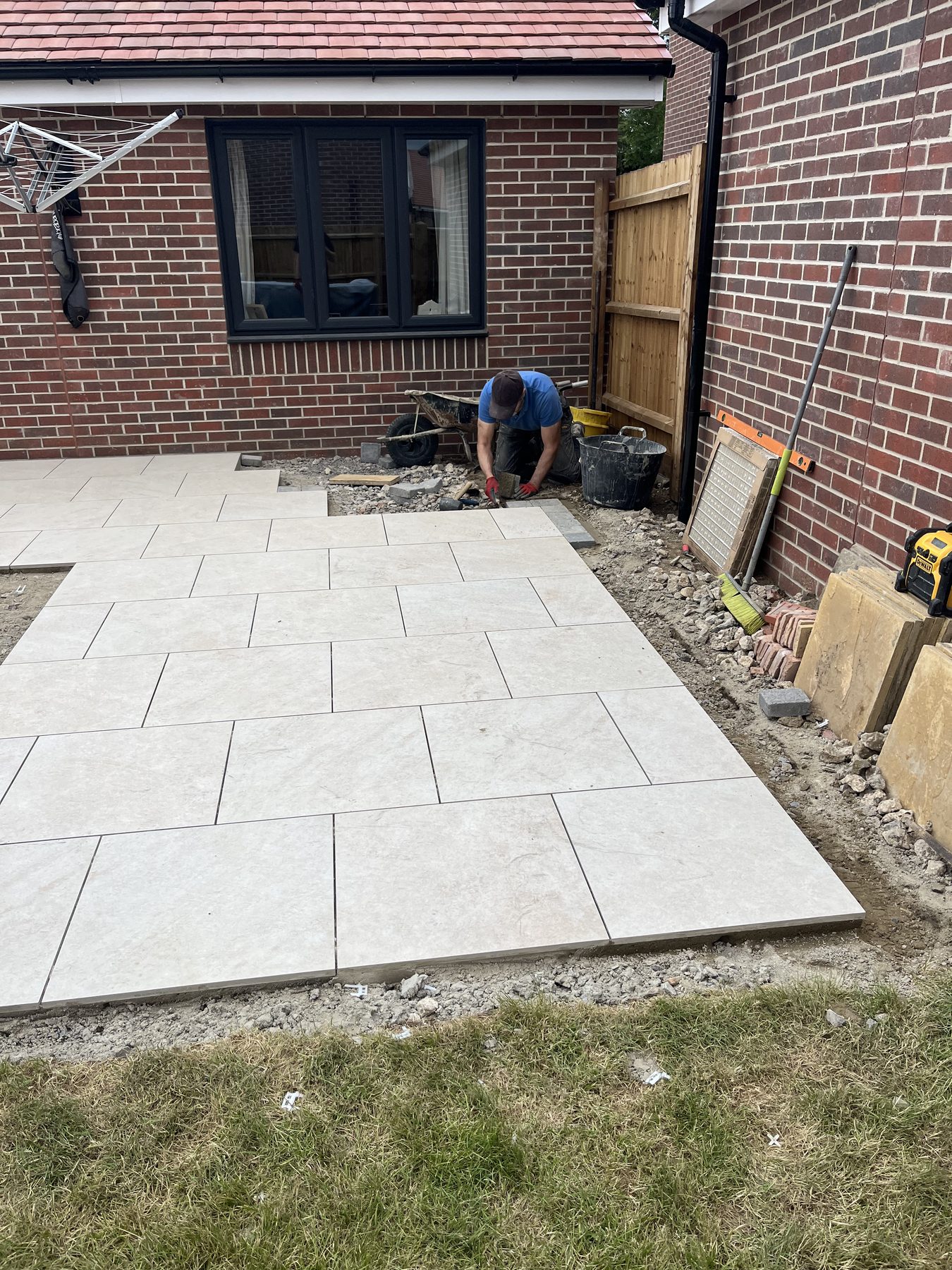 Porcelain slabs being laid with levelling clips in Stilton