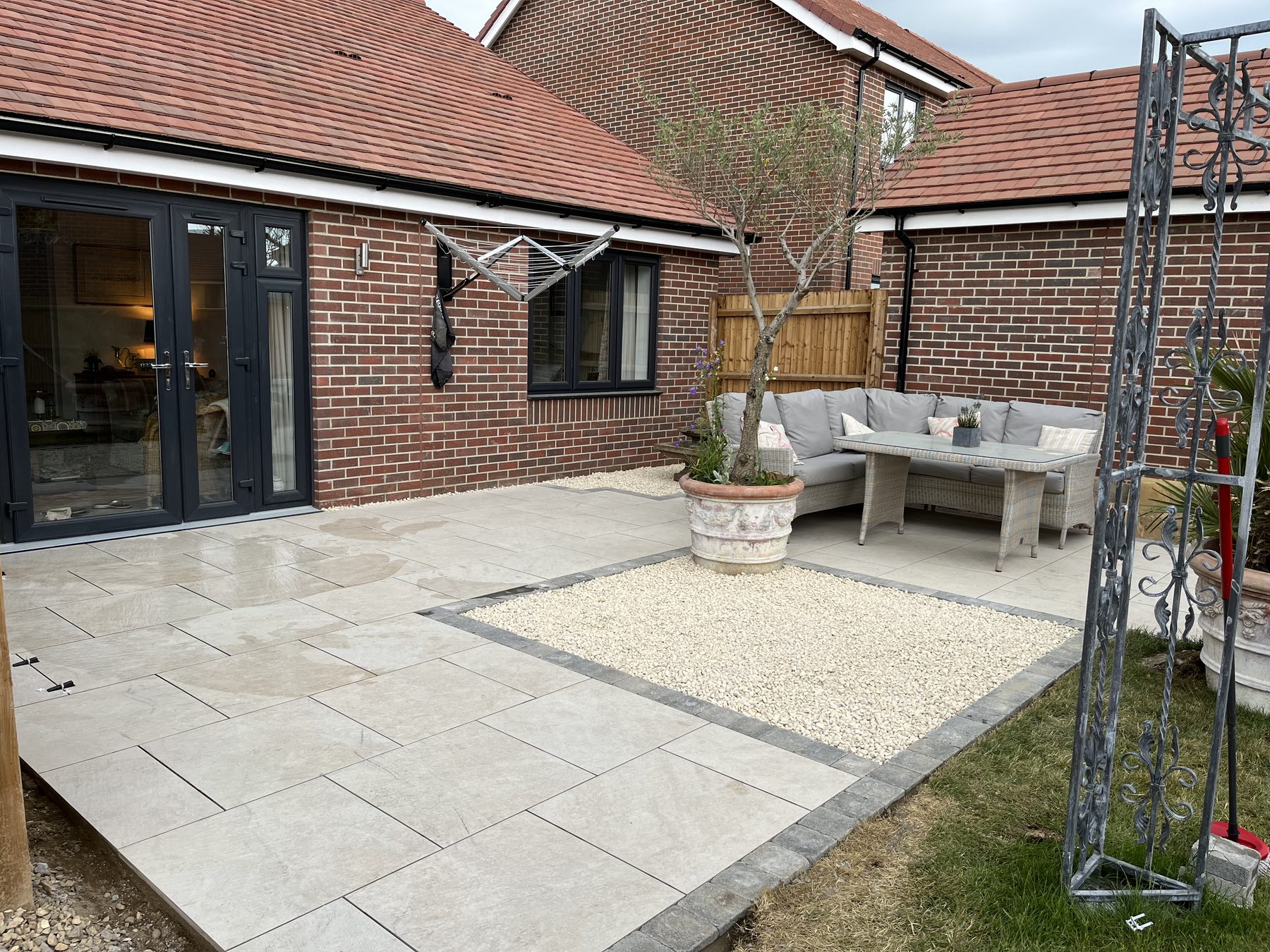 Final stages of porcelain patio installation in Stilton