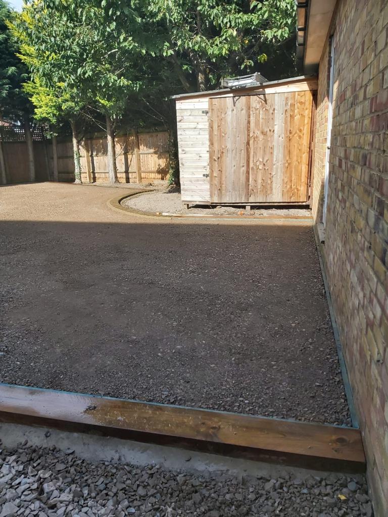 Sub-base laid and compacted around shed in Turvey, Bedfordshire garden