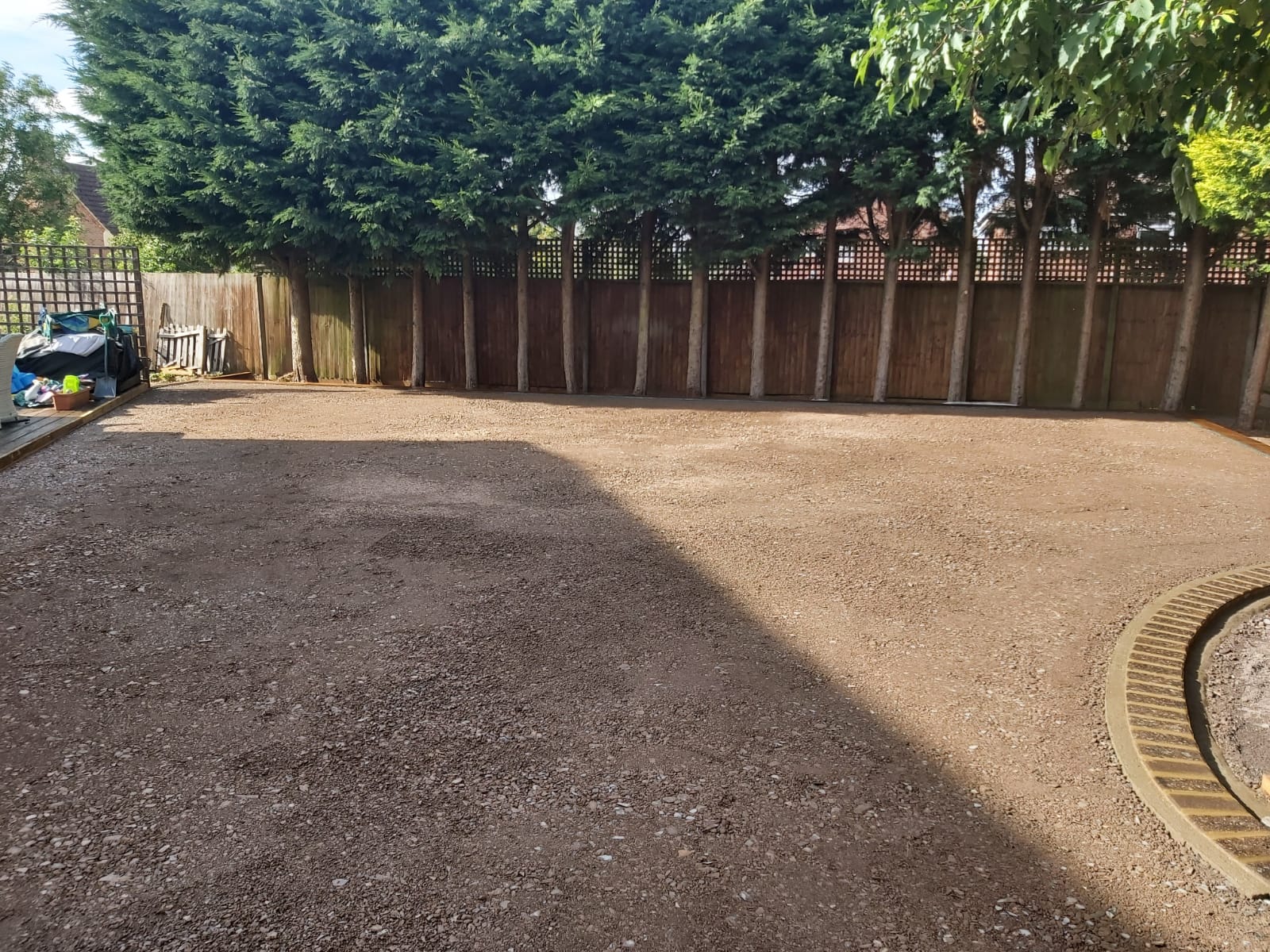 Wide view of fully prepared and compacted sub-base ready for artificial grass in Turvey, Bedfordshire