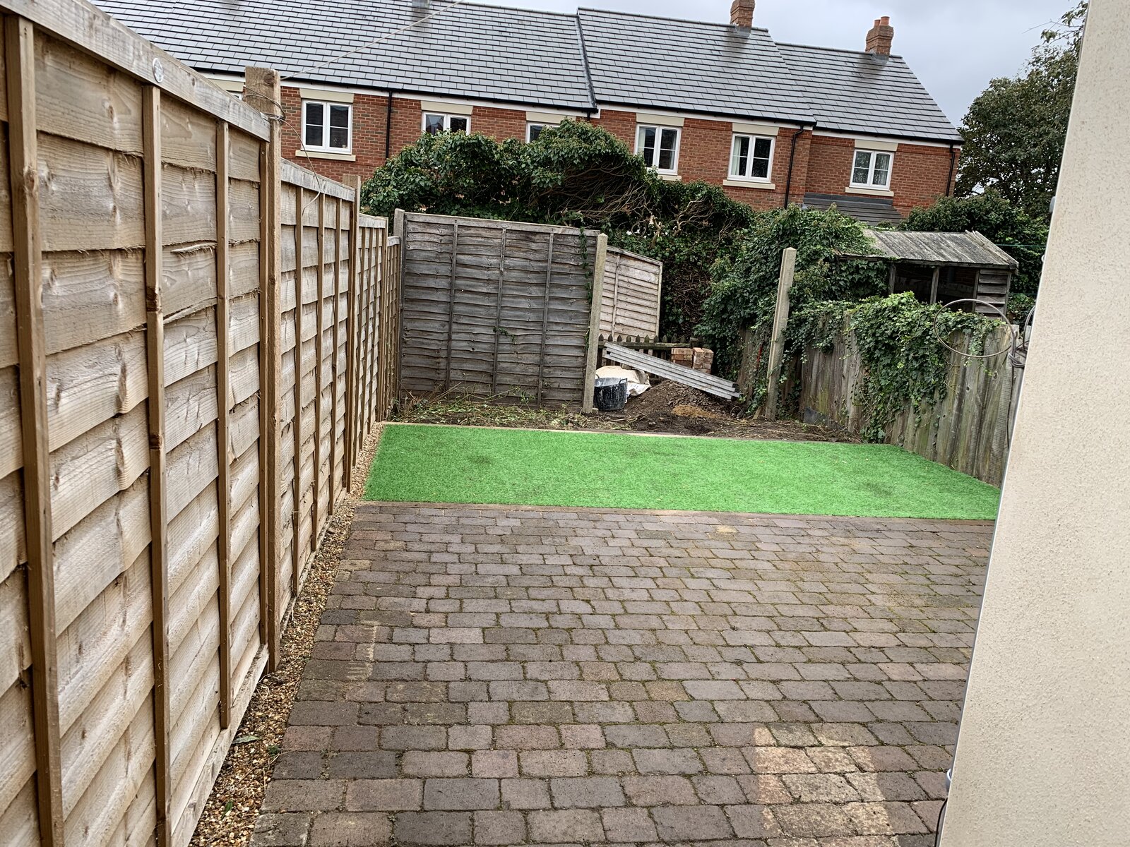 Bedford rental garden after full clearance and professional artificial grass installation by Arcadia Build & Landscape
